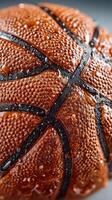 Close-up of a wet basketball highlighting texture and detail during a game on a rainy day photo