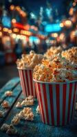 Enjoying fresh popcorn at a lively outdoor fair in the evening lights photo