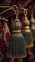 Elegant decorative tassels hanging from rich fabric in a luxurious interior setting photo