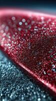 Close-up view of sparkling red glitter on a shiny surface highlighting textures and colors in a creative artistic setup photo
