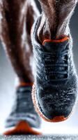 Runner in motion splashing through water during a foggy morning workout session photo
