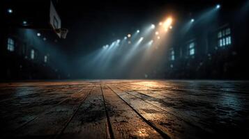 Dramatic basketball court illuminated by spotlights creates an intense atmosphere for players and spectators during an evening match photo