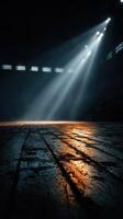 Light breaks through windows creating dramatic reflections on the wooden floor in an empty arena photo