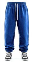 Stylish blue sweatpants with elastic cuffs and casual sneakers on a white background photo