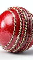 Close-up view of a vibrant red cricket ball with detailed stitching, showcasing craftsmanship and design in sports equipment photo