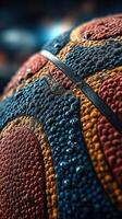 Close-up view of textured basketball with water droplets highlighting its surface during a game night photo