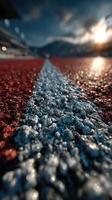 Close-up view of a racing track with water droplets at sunset lighting the scene photo