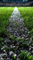 Close-up view of textured turf and gravel pathway on a sports field during a day game, highlighting vibrant green grass and gravel contrast photo