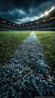Close-up view of a soccer field line during a dramatic late afternoon match at a stadium photo
