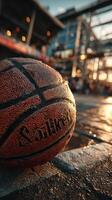 Evening basketball at the court with a focus on the ball and vibrant surroundings photo