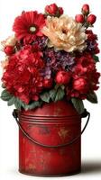 Vibrant floral arrangement in a vintage red canister adds charm to any space photo