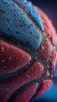 Close-up of a wet basketball showing texture and colors in a vibrant setting during a sports event photo