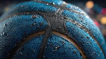 Close-up of a wet blue basketball with droplets reflecting colorful lights in a gym setting during an evening practice session photo