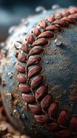 Close-up of a weathered baseball with droplets, showcasing intricate stitching and texture during an outdoor game in late afternoon light photo