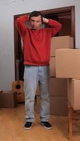 A man standing in front of boxes in a room video