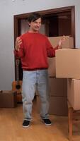 A man standing in a room with boxes video