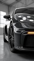 Sleek black sports car in a modern indoor showroom with bright lighting and polished floor photo