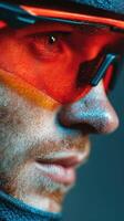 Athlete with vibrant sunglasses showcases focus and determination during a close-up performance session photo