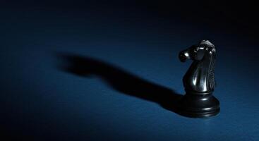 Black Chess Knight with Long Shadow photo