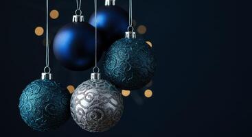 Elegant blue and silver Christmas ornaments with glitter patterns and bokeh lights photo