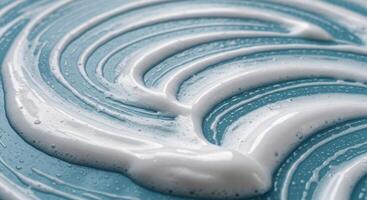 Close up macro shot of white cleaning foam texture on blue surface photo