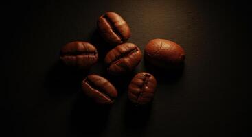 Overhead View of Roasted Coffee Beans on Dark Textured Surface photo