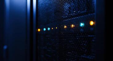 Server rack metallic mesh door with blue and amber status lights photo