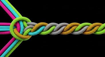Colorful ropes braiding together symbolizing connection unity and strength photo