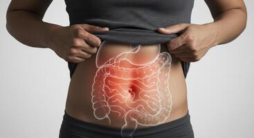 Woman with Glowing Digestive System Overlay Showing Abdominal Pain photo