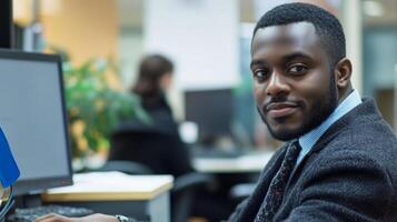 A Confident Black Businessman Working at His Desk photo