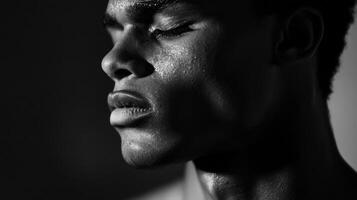Close-up Black and White Portrait of a Man's Face with Sweat photo