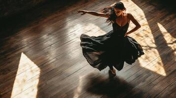 A Woman in a Black Dress Spins on a Wooden Floor photo