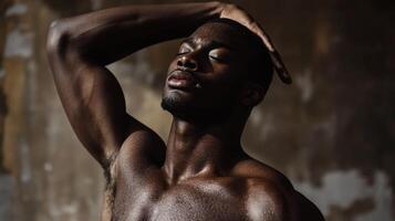 A Close-Up Portrait of a Sweaty Black Man with Closed Eyes photo