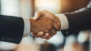 Close-up of Two Businessmen Shaking Hands photo