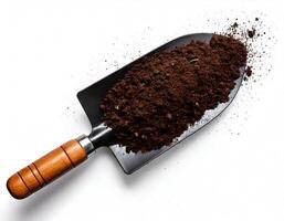 Top view of Soil with garden tool on white background photo