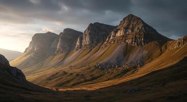 A mountain range with a sunset in the background photo