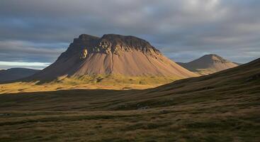 A mountain with a cloud photo