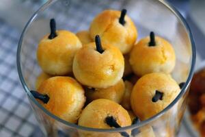 Nastar is Indonesian pastry, traditionally served during festive occasions like Eid al-Fitr, Christmas or Chinese New Year. It is a small, buttery, and crumbly cookie filled with a sweet pineapple jam photo