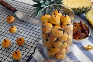 Kue Nastar is Indonesian pastry, traditionally served during festive occasions like Eid al-Fitr, Christmas or Chinese New Year. Small, buttery, and crumbly cookie filled with sweet pineapple jam photo