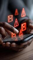 Urgent email warning with holographic alerts while a user types on a mobile device photo