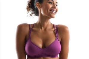 Woman in purple sports bra smiling in a bright setting against an isolated white background photo