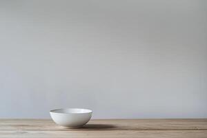 White bowl on wood table plain backdrop photo
