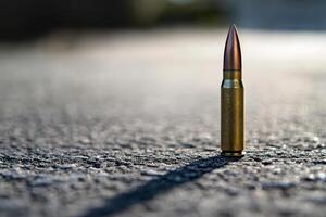 Bullet standing on a surface during daylight photo
