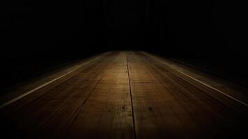 Dark wooden floor perspective view in shadow with dramatic lighting for backgrounds photo