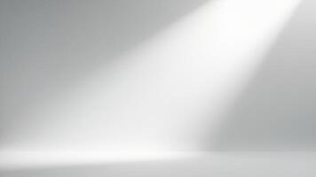 Minimalist studio room with bright spotlight and soft lighting on a clean gray background for presentation. photo