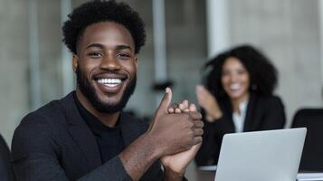 Successful business professional receives applause. A joyful man gives a thumbs up during a meeting, showing approval and success. A woman claps in the background, photo