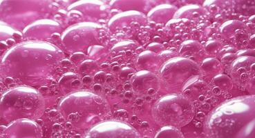 A pink background with bubbles and bubbles photo