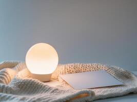 A lamp and a card on a table photo