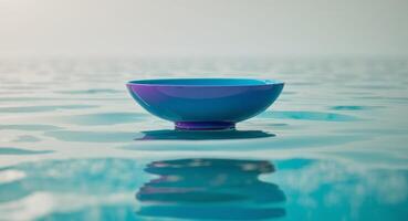 Blue and Purple Ceramic Bowl Floating on Water, Artistic Still Life, Minimalist Design photo