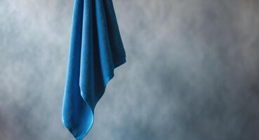 Azure Serenity. A Blue Towel Against a Textured Background, Studio Composition. photo